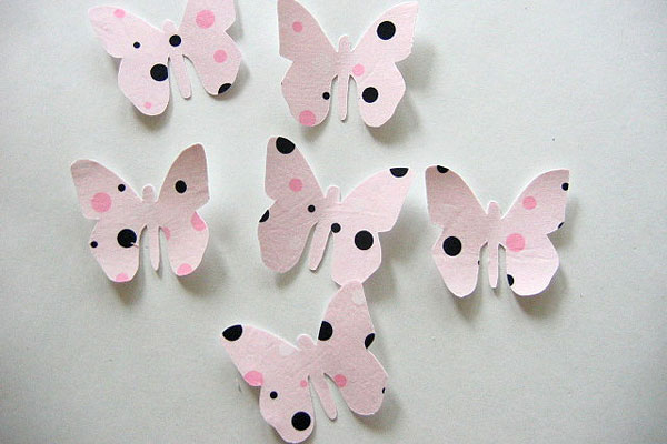 Black, pink, and white polka-dot butterflies