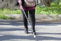 Blind woman with walking stick