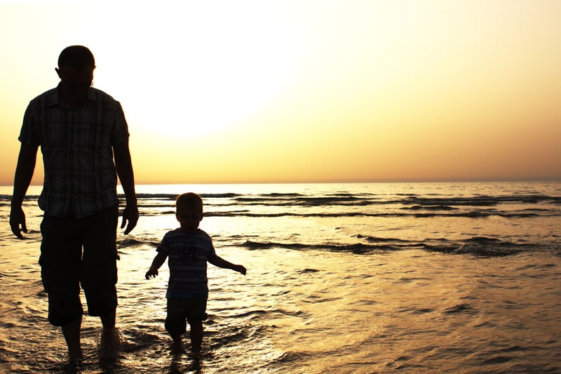 Father and child at the sea