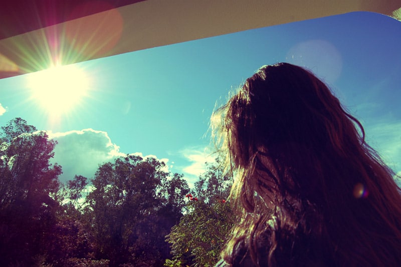 Girl looking at sunlight
