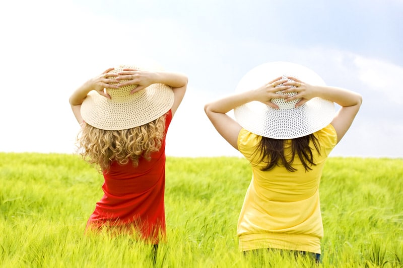 Back view of two girls, in the field