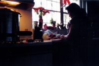 Mother preparing food in kitchen