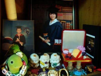 My bookshelf with my graduation photos