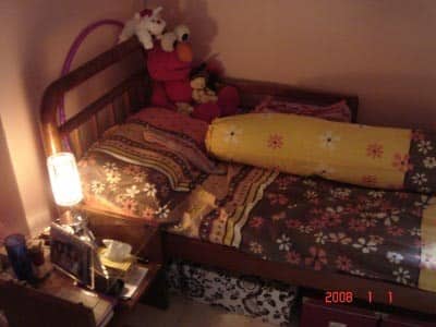 My bed with floral bedsheets