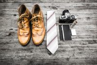 Work attire and equipment: Shoes, Tie, Camera, Notebook, Pen, Money